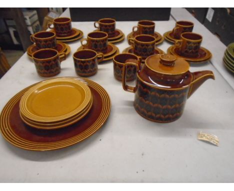 Hornsea 'heirloom' 1976 set in saffron colour  comprising of a teapot, serving plate, 11 cake plates, 8 saucers and 12 cups