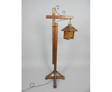 Arts and Crafts style adjustable oak standard lamp with lantern shade