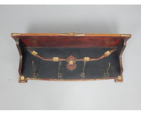 Early 20th century hall shelf, polychrome painted and fitted with four brass two prong hooks, 81cm w