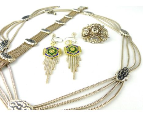 White metal and niello multi-strand bracelet, with a similar necklace, two enamel ear drops and a brooch. (4)