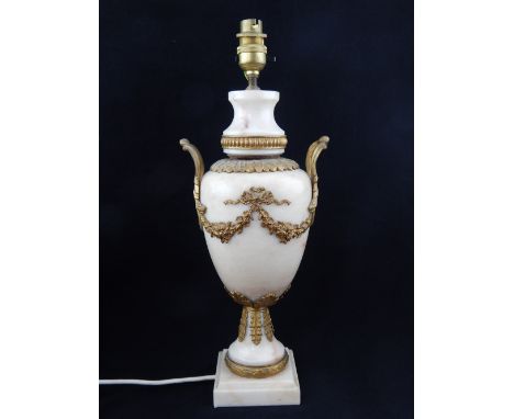 Brown marble table lamp of lidded urn form, bead collar, leaf neck, acanthus handles and floral swags, further leaf work to b