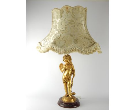 Victorian style gilt metal table lamp modelled as Cupid on faux marble base 62 cm H 