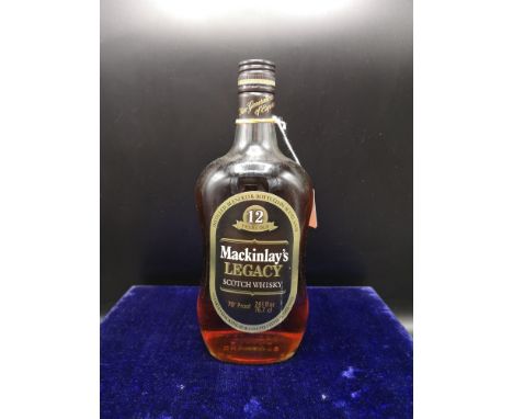 Bottle of 12 year old  mackinlay legacy scotch whisky 70% proof 26 2/3 fl ozs 75.7 CL. Full and sealed. 