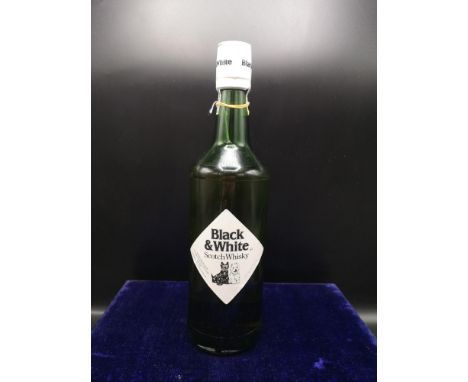 Bottle of Black &amp; White scotch whisky full and sealed. 