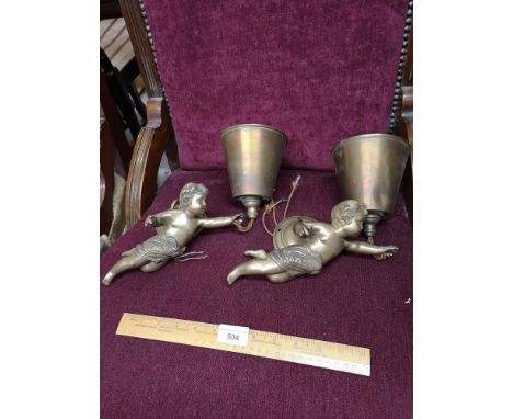 Pair of heavy  quality brass cherubs wall light s with electrical fitting s. 