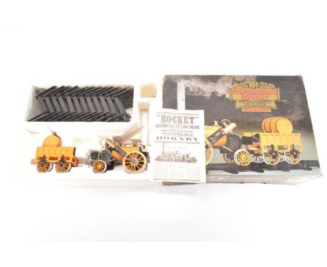 A Hornby G100 3.5" Gauge Live Steam Stephenson's Rocket Set, in original box, comprising gas-fired loco, tender and 96-piece 
