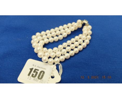 A three row cultured pearl bracelet, 7mm pearl, with a 18ct white gold clasp and spacers