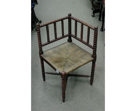 A bobbin turned corner chair