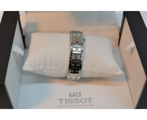 A boxed Tissot ladies diamond bezel watch.
