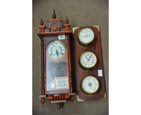 A modern wood wall clock and clock barometer display