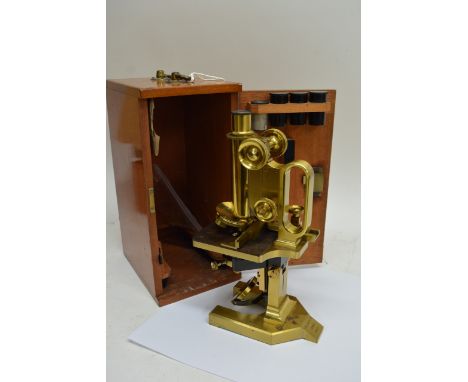 An R&J Beck of London brass microscope 30523 in original wooden case with key plus two boxes of accessories including lenses,