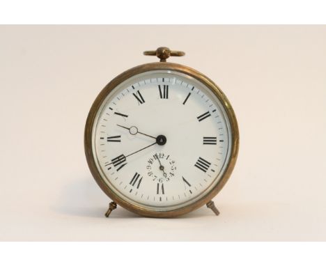 A brass alarm clock with key 