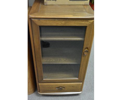 A contemporary Ercol Hi-Fi music cabinet with lift top and glass front in mid brown colour