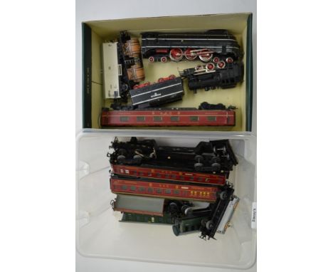 An unboxed Marklin Sk800 locomotive and tender together with an unboxed pre-war locomotive and pre-war coaches x 4 wagons x 3
