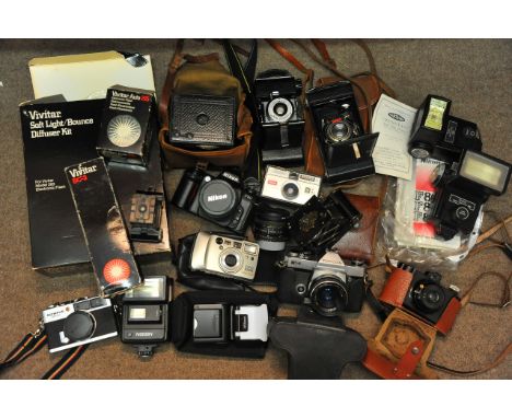 A collection of cameras and accessories to include a vintage bakelite camera, Kodak instamatic model 50 and others.