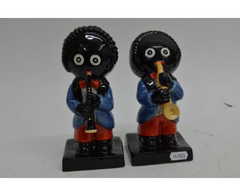 Two Carltonware golly musician figures comprising a Clarinetist 28/250 and Saxophonist 76/350, approx 19cm tall.