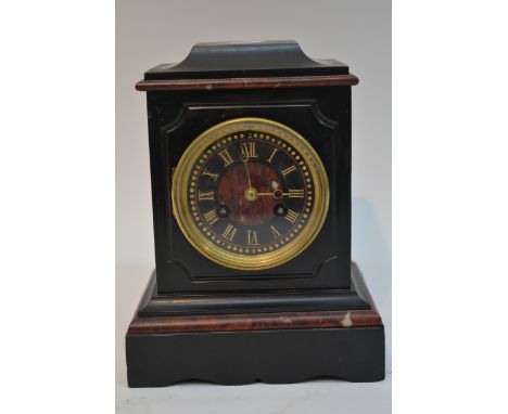 A black and rouge red marble mantle clock with painted Roman numeral dial