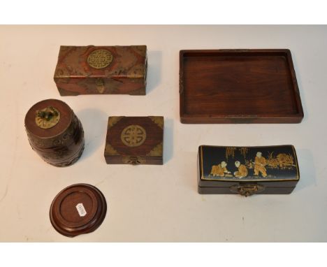 A Japanese lacquered box decorated with figures playing, an ivory page turner and a collection of brass bound boxes of simila