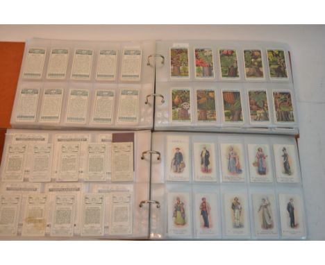 A collection of five albums of cigarette cards