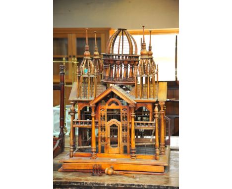 An unusual Edwardian bird case on stand, in a regency classical architectural style (70cm x 72cm approx, 100cm approx high) 