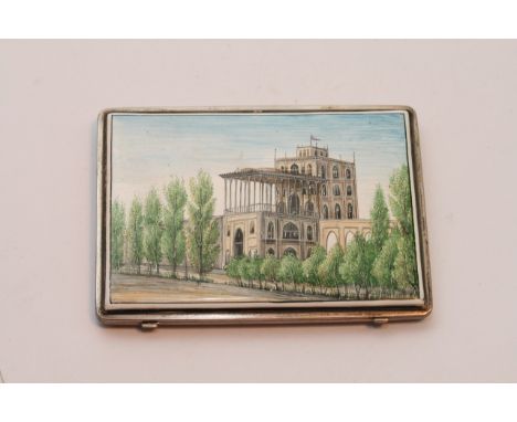 An Indian white metal cigarette case with enamel scenes building, flowers and foliage