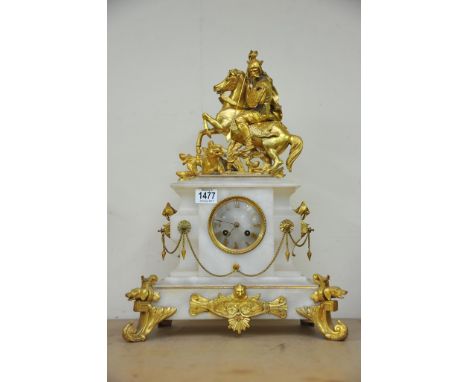 A 19th Century French mantel clock the top surmounted with a gilt soldier on horse back, the onyx case inset with circular di