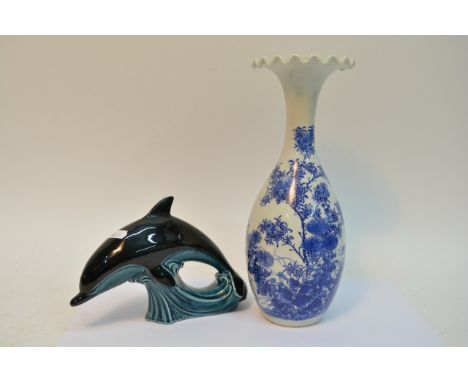 A blue and white Oriental vase and a Poole dolphin (2).