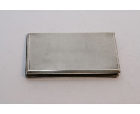 A silver cigarette case, Birmingham hallmarks.