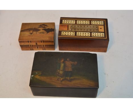 An antique puzzle box, Russian box and a cribbage board (3).