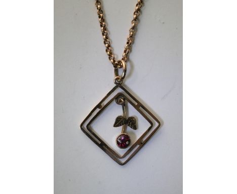 A 9ct gold necklace with attached pendent in the form of an open square with a suspended Ruby.
