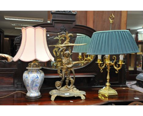 An antiques style stick stand of classical form and two antique style side lamps 