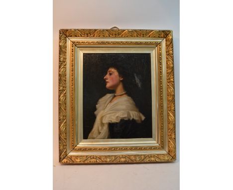 A late Victorian portrait of a girl in an ornate gilt frame (some repairs), approx 64cm x 73cm including frame.