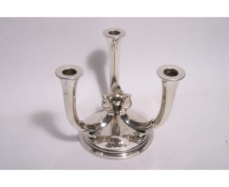 A silver plated WMF three arm candlestick of modernist design