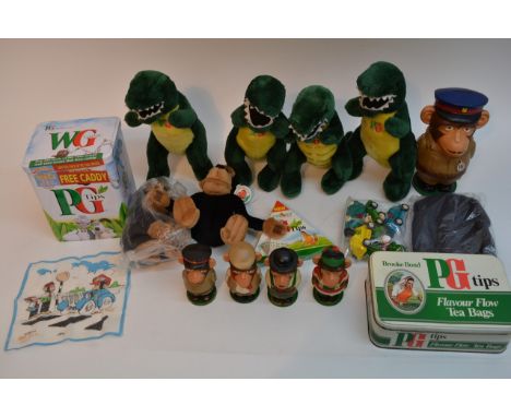 A box containing a variety of mint and boxed Brooke Bond tea items including chimp money box and eggcups, 'Bump and Go' cars,