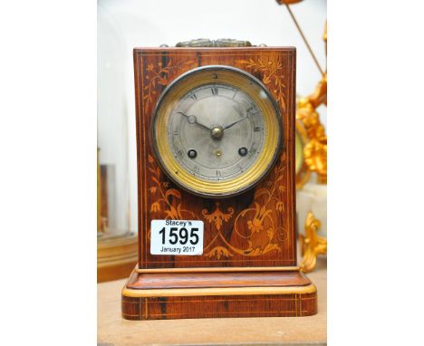 A French inlaid Mantel clock the silver dial with roman numerals 