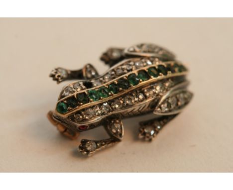 A quality gold and diamond set frog brooch having single row of emeralds to back and ruby eyes, some stones missing