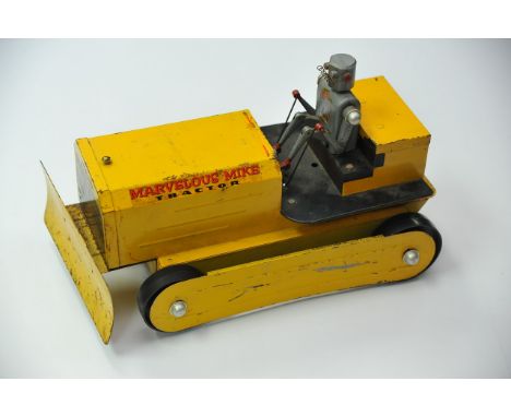 A tin plate Marvellous Mike tractor toy with robot driver.