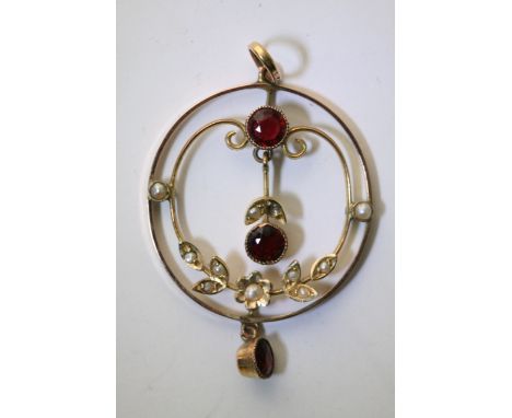 A Vintage gold open pendant set with Rubies and seed pearl.