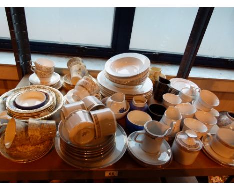 Shelf of mixed china tea services