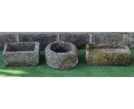 A SMALL SANDSTONE TROUGH, oblong, 21" X 10" X 6", together with another, 13 1/2" x 14 1/2" x 5 1/2", and a rough hewn circula