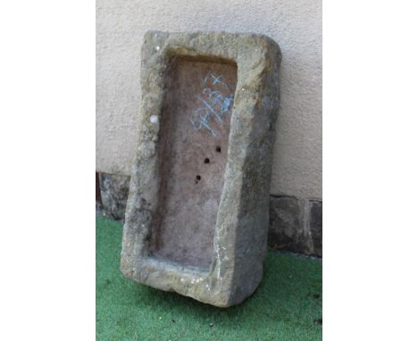 A SANDSTONE TROUGH of rough hewn oblong form, 31 1/2" x 16 1/2" x 9" (Est. plus 24% premium inc. VAT)Very good