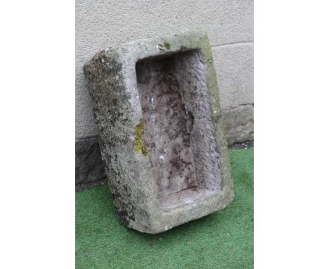 A SANDSTONE TROUGH of rough hewn oblong form, 27 1/2" x 17" x 10" (Est. plus 24% premium inc. VAT)Very good