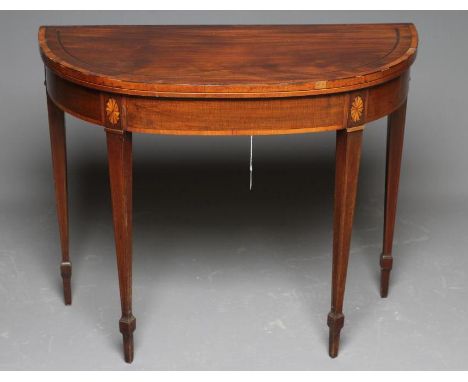 A GEORGIAN MAHOGANY FOLDING CARD TABLE of D form with satinwood banding and stringing, the top lined in red baize, raised on 