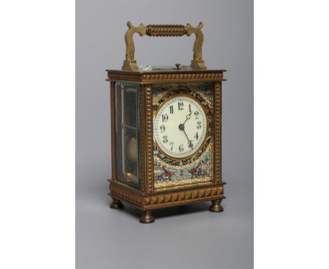 A BRASS CASED CARRIAGE CLOCK, the twin barrel movement with platform escapement and repeat mechanism striking on a gong, 2 1/