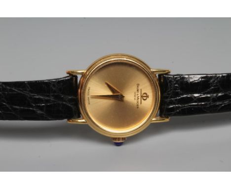 A LADY'S 18CT GOLD BAUME & MERCIER WRISTWATCH with plain dark champagne dial, seventeen jewel movement numbered 770, cabochon