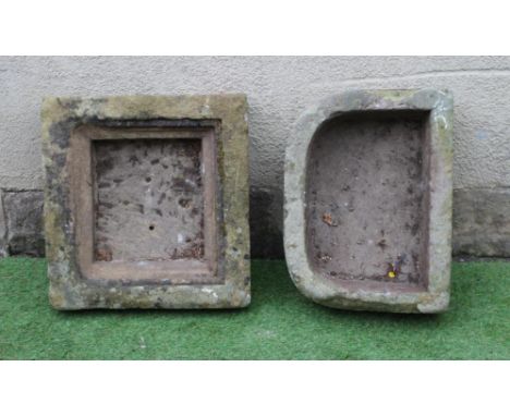 A SMALL SANDSTONE TROUGH of D form, 21 1/2" x 15 1/2" x 7", together with a square trough with stepped interior, 19 1/2" x 7"