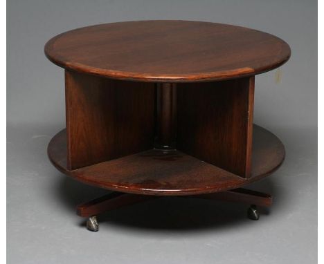 A ROSEWOOD REVOLVING BOOKCASE, mid 20th century, of two tier circular form with turned central support, banded top and trifor