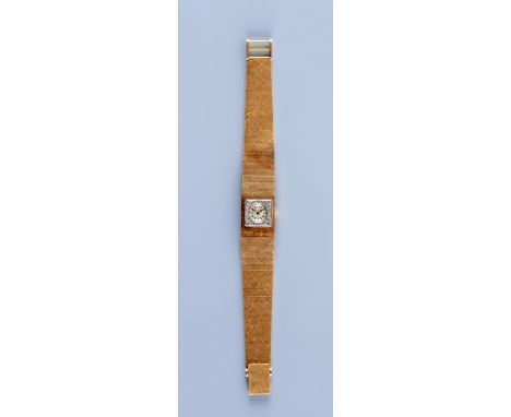 A LADY'S 18CT GOLD AND DIAMOND OMEGA WRISTWATCH, the silvered dial with applied white metal batons, the seventeen jewel movem