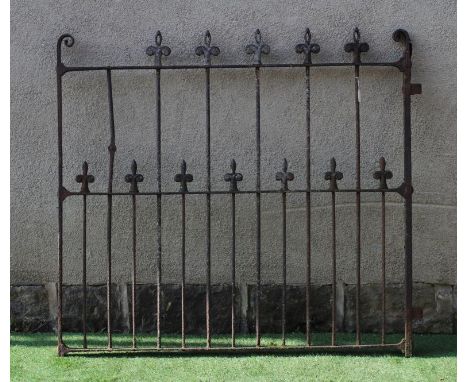 A VICTORIAN CAST IRON GARDEN GATE of two tier barred form with fleur de lys finials and scroll headed square section frame, 5