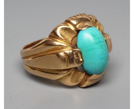 A GENTLEMAN'S RING, the oval cabochon polished turquoise set to an open fancy surround and wide shank, unmarked, size S (Est.